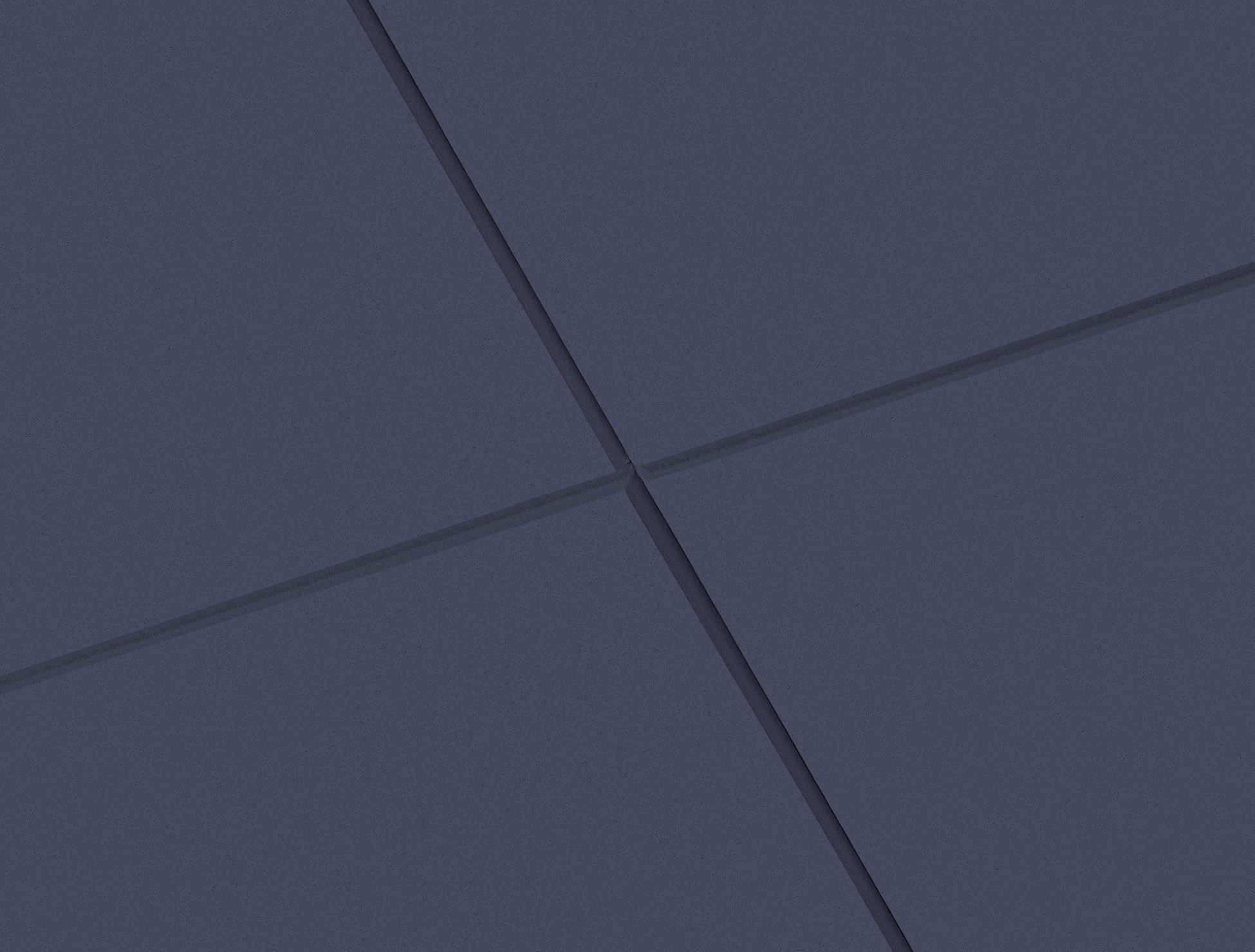 A close-up of four dark blue, textured tiles intersecting at the centre with visible grout lines forming a cross pattern. The tiles are smooth and evenly arranged, creating a geometric, modern look.