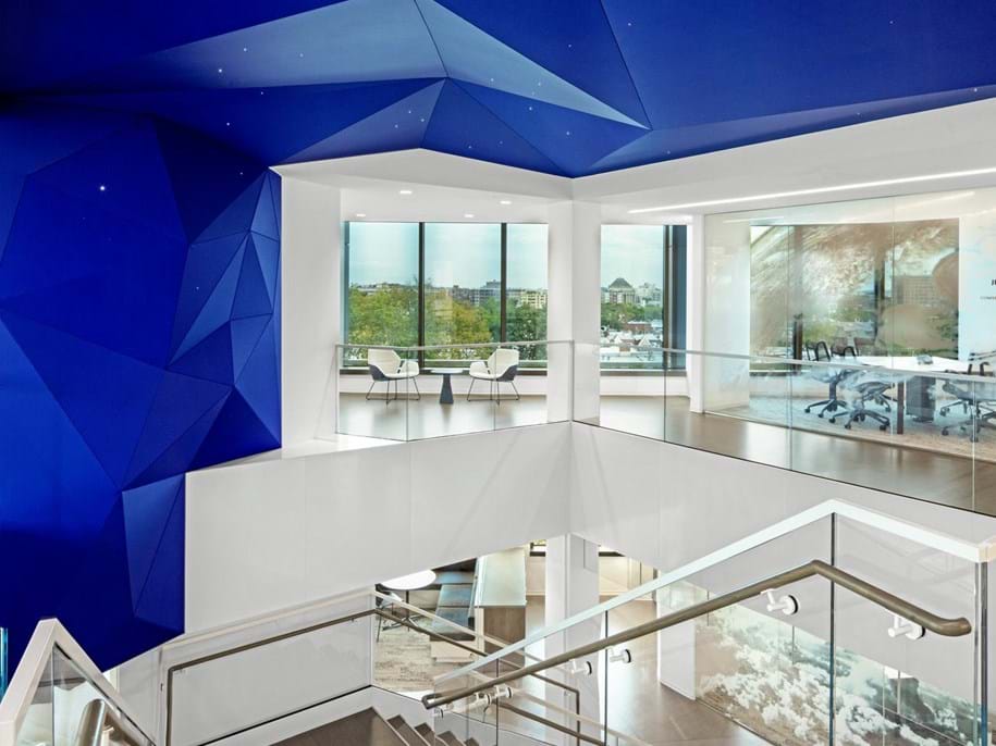 Acoustic stretch fabric in office staircase and ceiling