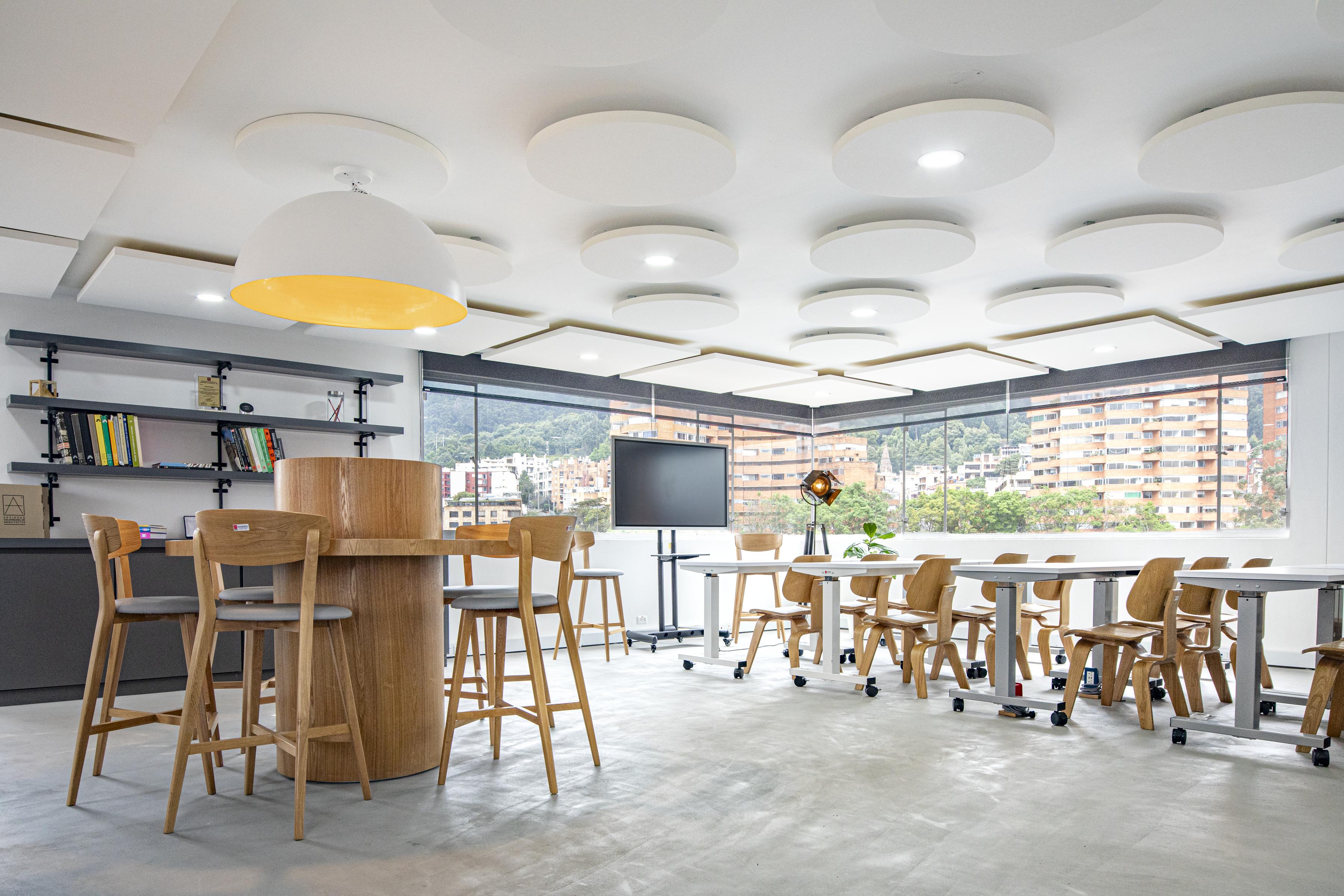 Free-hanging acoustic panels in office co-working space