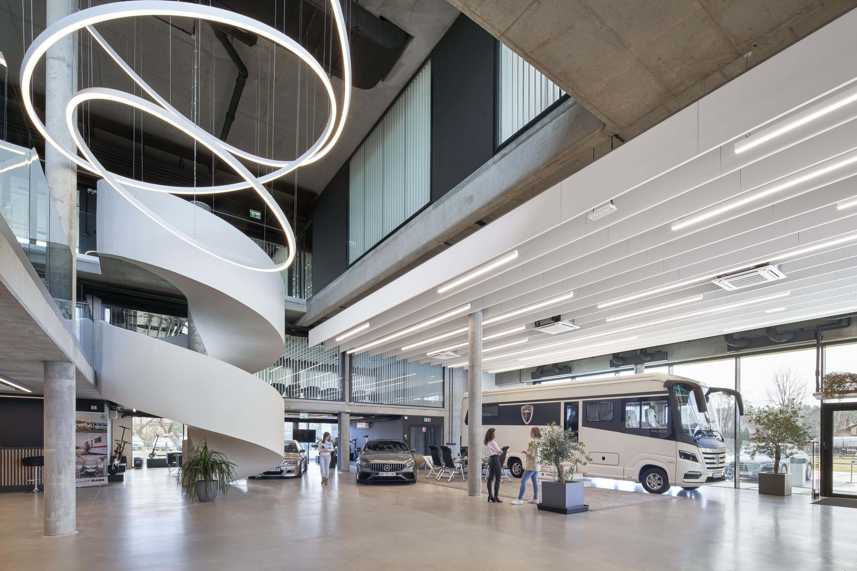 Free-hanging acoustic panels in caravan showroom