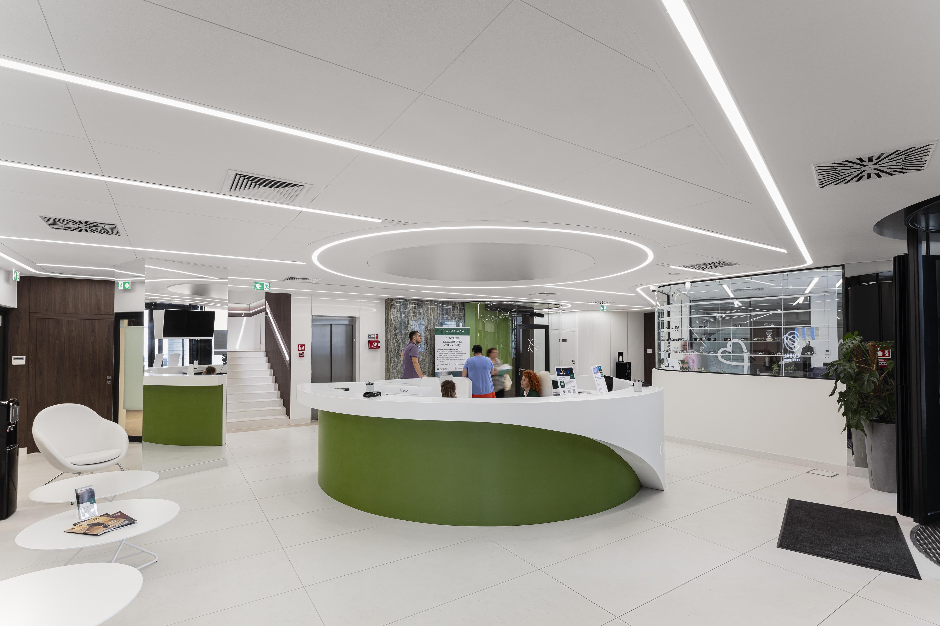 Acoustic ceiling with concealed grid in hospital reception area