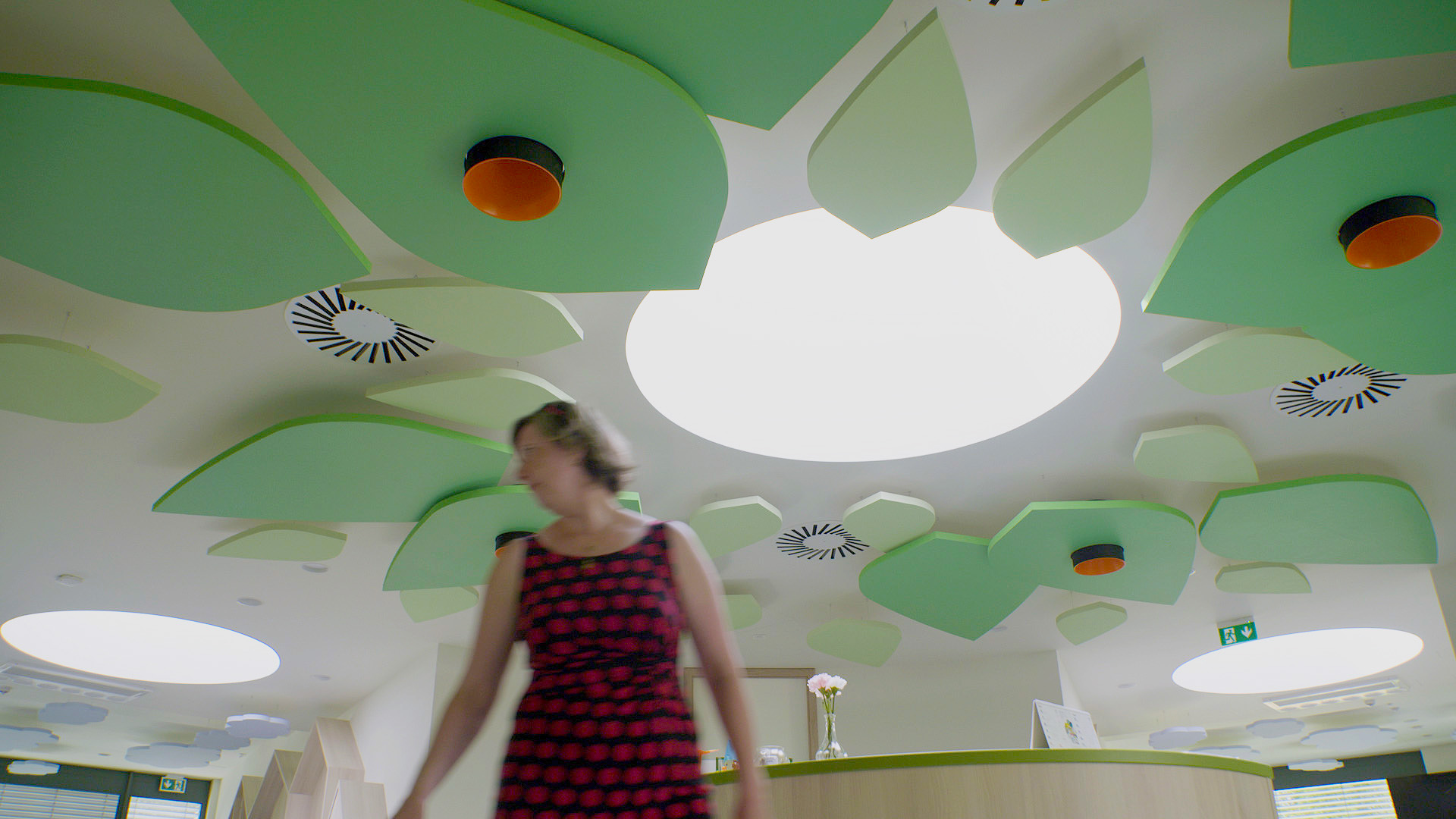 Acoustic free-hanging ceiling panels in the shape of leaves in kindergarten