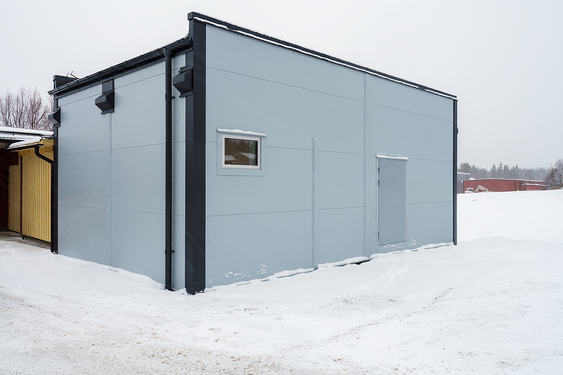 Exterior of prefabricated module for healthcare services in a snowy landscape