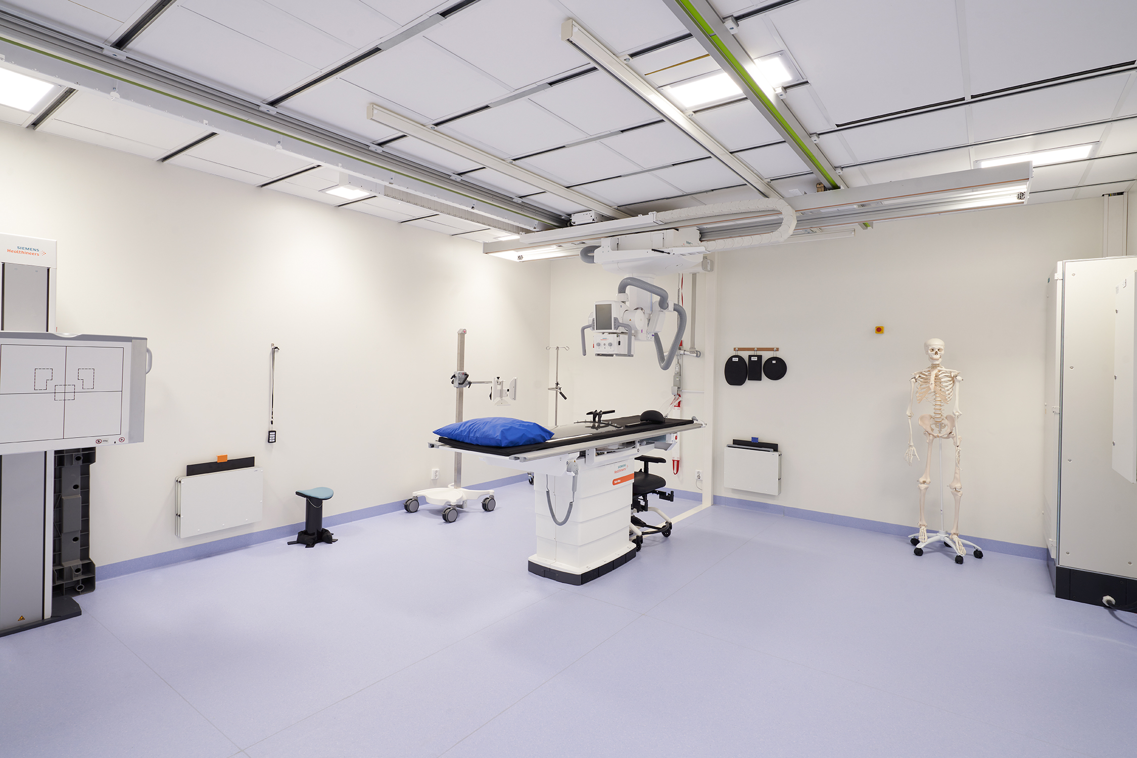 White, suspended acoustic ceiling in radiology facility