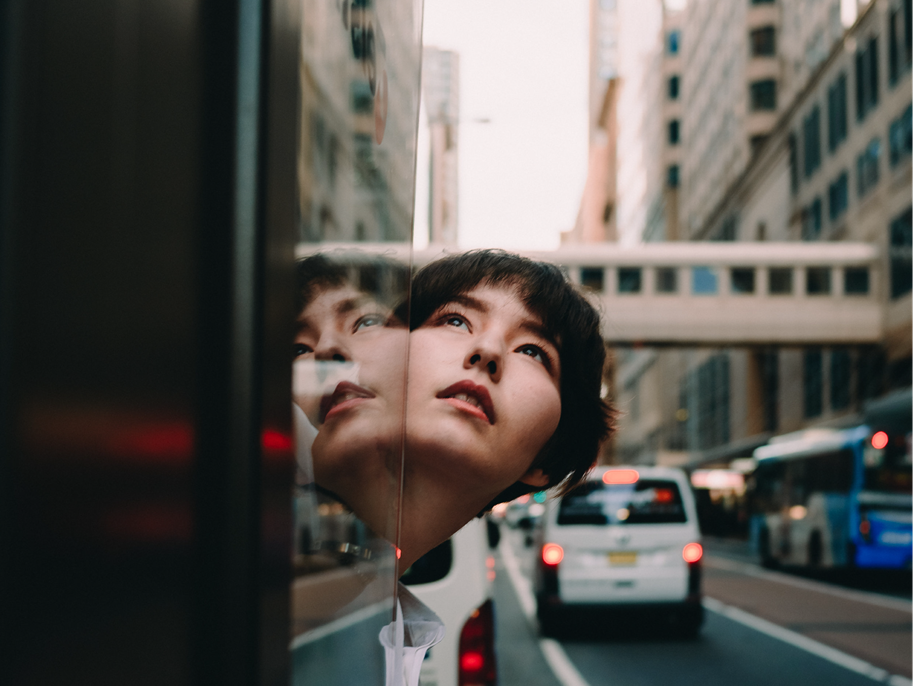 Woman sticking head out of car