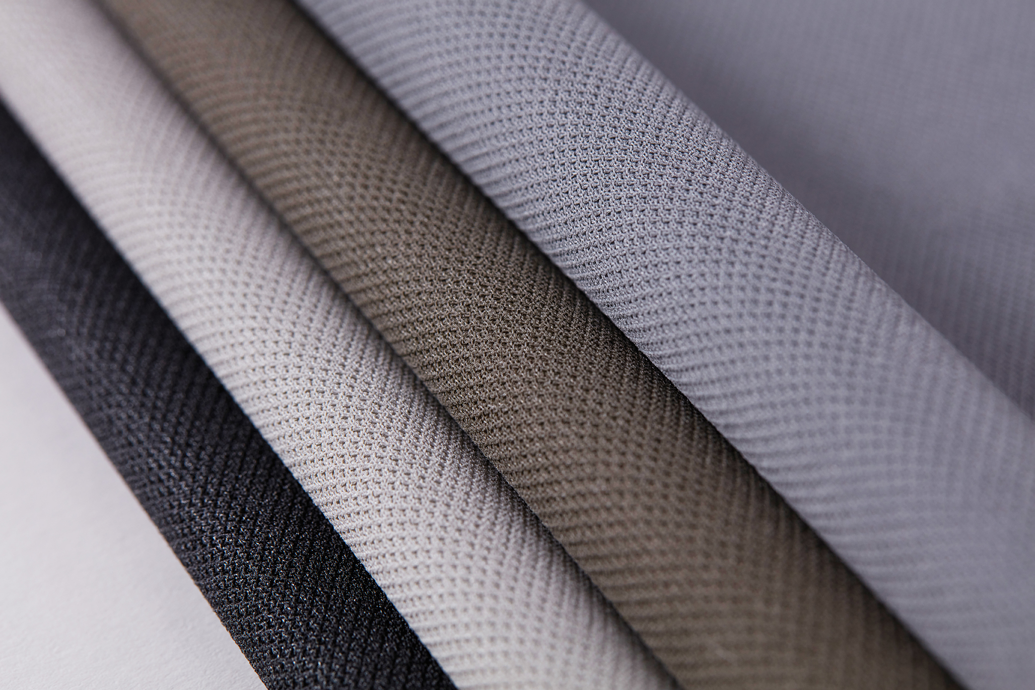Close-up of Clipso stretch fabric in different colours