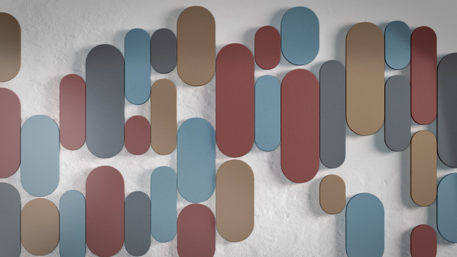 Oval shaped acoustic wall panels in different colours